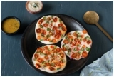 UTHAPPAM: Relish this sophisticated dosa with veggie garnishing